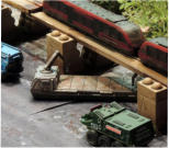 The wrenchmobile acts as a distraction and drives under the monorail with guns blazing but pays the price