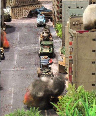 The look down main street as a Combat Car is hit by an IED