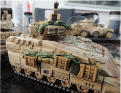 Ajax MICV with stowage added. Stowage is weathered, decals added vehicle is dipped and matted, vision blocks added in Tamiya laquer