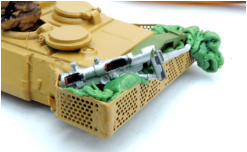 Some pre-painted bits form the spares box are pushed into the putty
