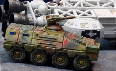 Jeeps and a missile truck with a command APC
