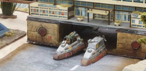 Combat and Command Car take shelter under the monorail station