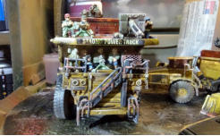 Front of the dump truck with guns and crew