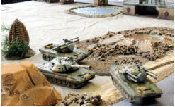 Two Ukrainian Buran AAA systems and a Groza artillery piece (Critical Mass games) advance into an ambush position either side of the main road