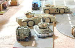 Marvellan Shark tank support vehicle and Manta-Ray APC with a crewman exiting the vehicle