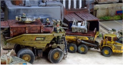 MLRS and large mining dump truck in action