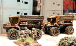 Lt Cain commanding the WRY debusses from his Tassigny APC and rushes past a parked vehicle, about to enter the building to gain a better firing position
