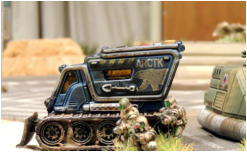 Lt Cain commanding the WRY debusses from his Tassigny APC and rushes past a parked vehicle