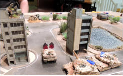 Lt Cain fires down on a Gryphon and the two Zentaurs - the former is ablaze, the latter now have wrecked guns