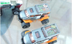 The roofs painted gunmetal to match the body work and then the clear plastic roof stowage has been painted in