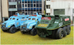 Two police trucks and an explosive truck. The Police trucks have lighter weathering - less in in the Future - plus light dry brushing. The explosives truck is Konami and out of the box