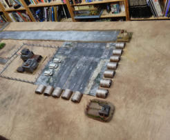 The North end of the table before deployment - Britains pig pens and Trek shuttles