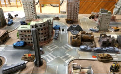 Two Legion tank destroyers recieve hits marked by the orange tokens - systems failures: no moving or firing next turn