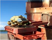 Crew member dismounts to check the cargo