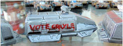 Solace Toughs transport - "Vote Grayle" says the spray can slogan! Old Crow Glaives