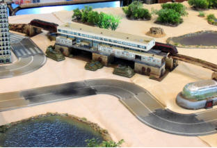 Hiroseki vehicles hiding behind the monorail station - the infantry are hidden inside
