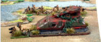 Infantry near a wrecked tank
