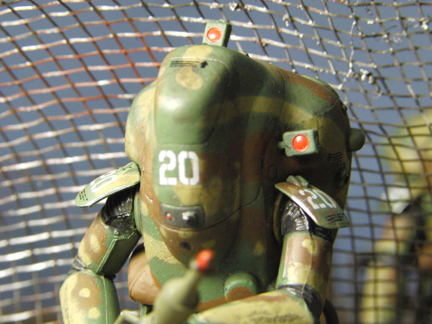 fences close up of 3 colour figure