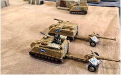 Two Stewart Kunitsas towing their Anti Tank guns