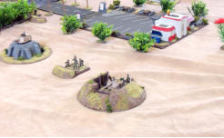 Stewart emplaced anti tank gun with supporting infantry defend the local McDonalds