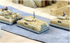 Two Stewart Artemis APCs following an Apollo MBT