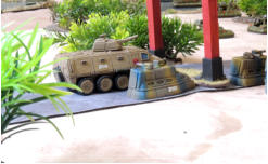 Fosters big Centurion APC advances past a much smaller Lightning Crew Car