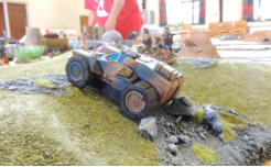 A Sincanmo buggy and their deployed infantry use the reverse slope for cover
