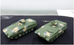 Two Sokols (Falcon) MICVs in green primer with camo applied