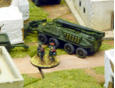 One engineering vehicle and related troops need to be next to the building and undisturbed for those turns in order to breach it