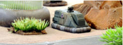 West Riding Yeomanry APC trying to find cover near a greenhouse