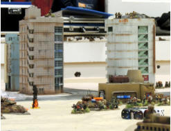 Solace Regular Army MICVs on the right flank take hits defending the objective building