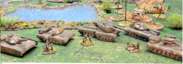 Two Vombats, a Mammont, a Bars MBT and a Vombat Terminator move forward with infantry support.